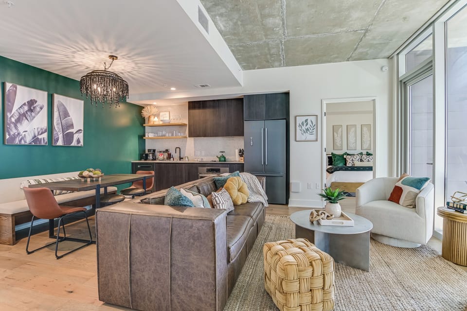 Open concept living room that flows into the kitchen and dining area