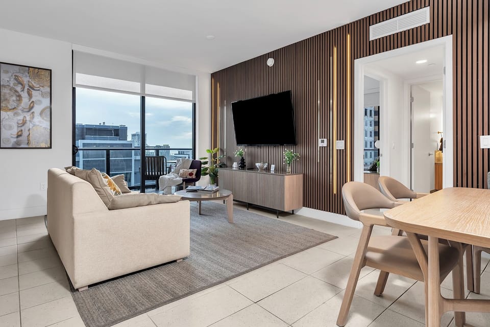 Large Smart TV and comfortable lounge chair for relaxing evenings.