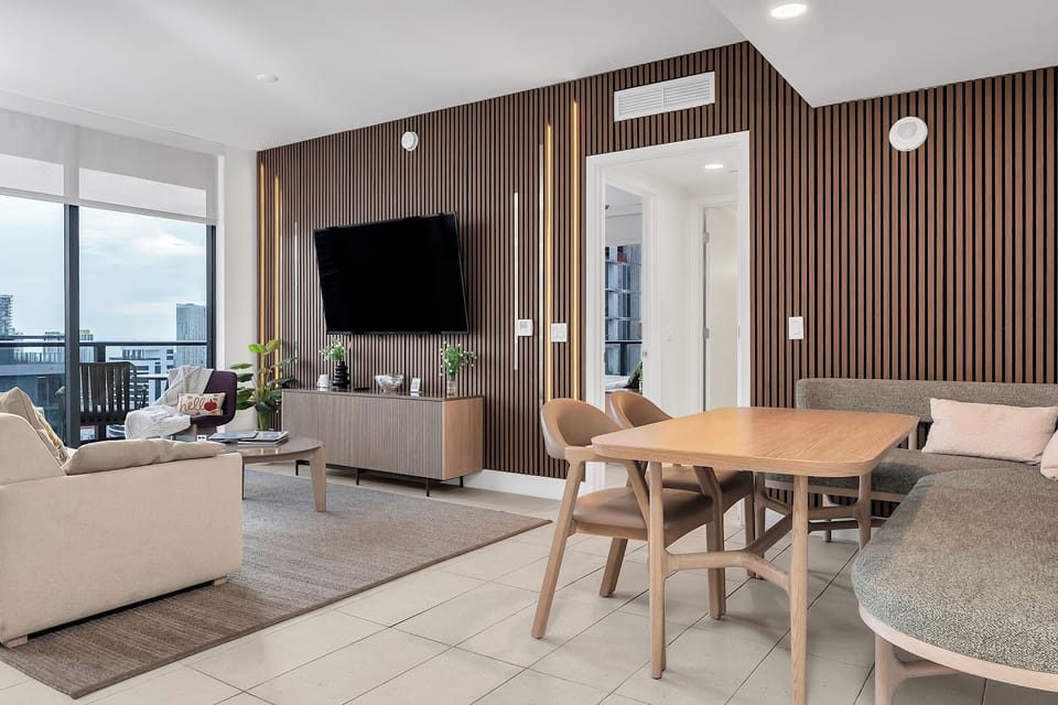 Remodeled living room with a custom LED accent wall and modern design.