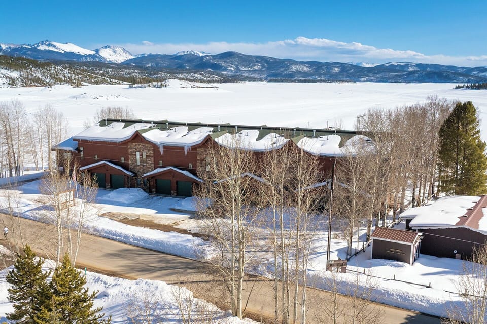 Beacon Landing Condos in front of frozen Lake Granby