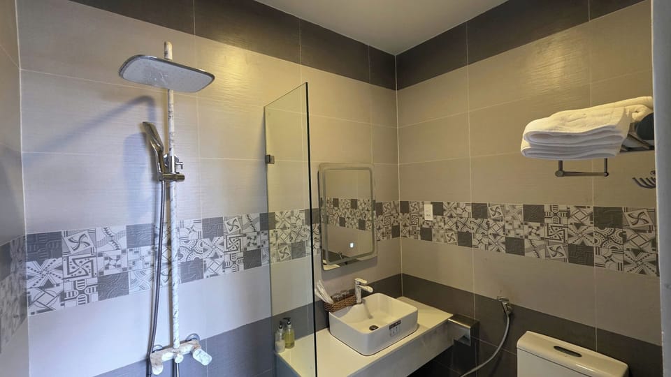 Shower, free toiletries, hair dryer, slippers