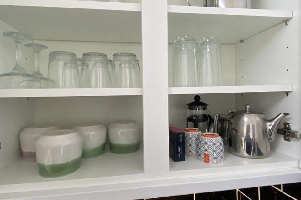 Plenty of glasses and cups for your use.
