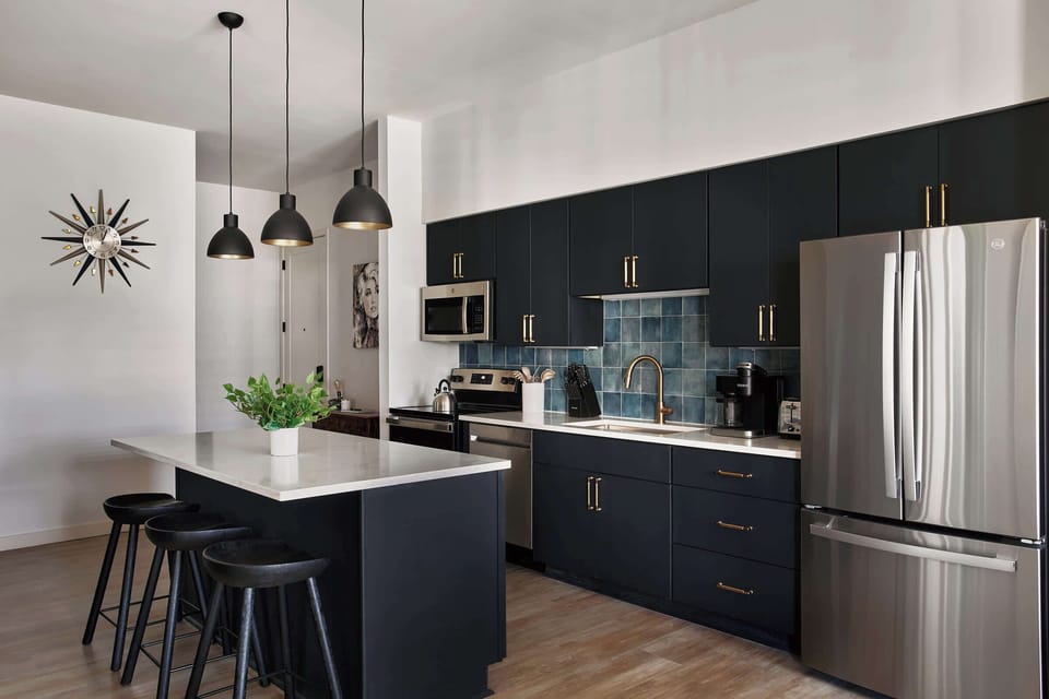 Stylish kitchen featuring sleek cabinetry, high-end appliances, and an open layout that flows seamlessly into the living area.