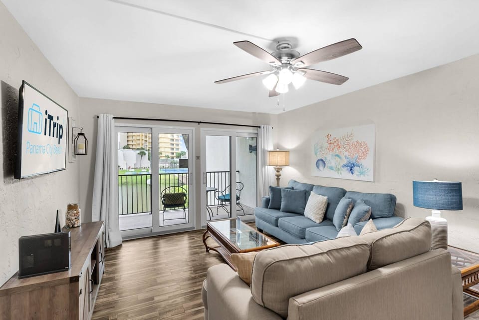 Comfy furnishings in the living room with direct balcony access