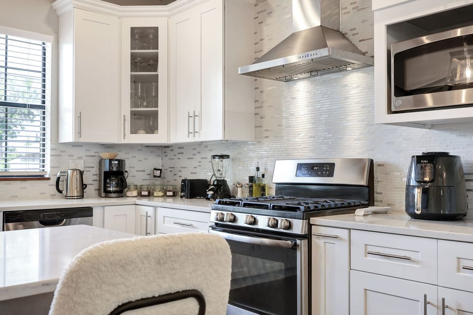Stainless steel appliances. Fridge dispenses water and ice. 