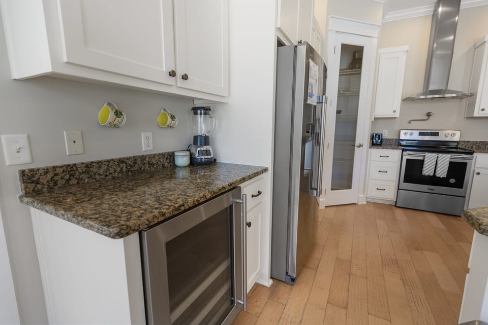 Your fully equipped kitchen awaits with granite countertops, stainless steel appliances, and everything you need to create memorable meals during your stay.