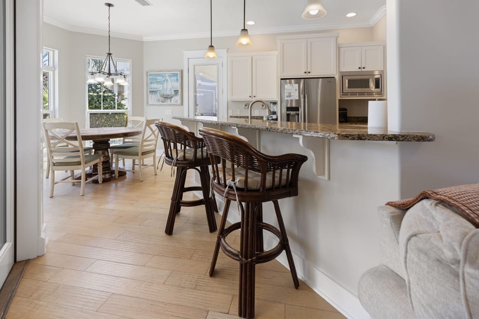 Your open kitchen flows beautifully into the dining area, perfect for morning coffee at the granite island or family meals together.