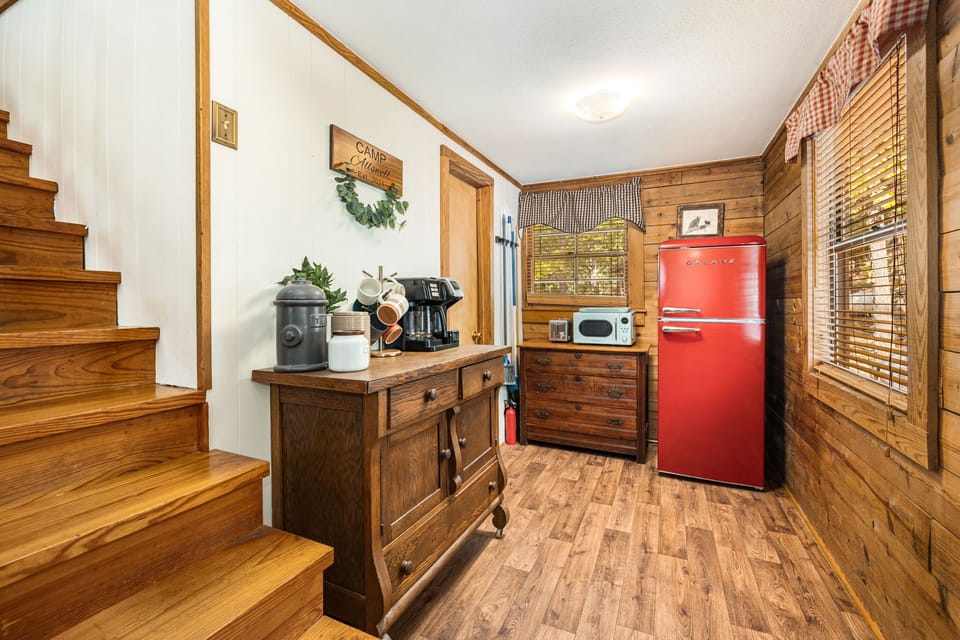 There's a small nook to the left with a coffee bar, refrigerator, and microwave.