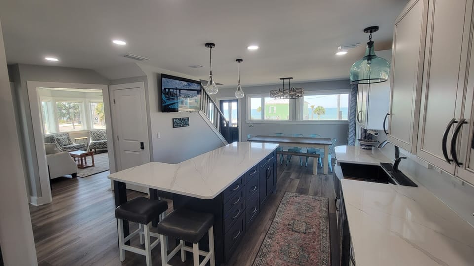 View from the back of the kitchen, you can see the family room and the large picture windows for your ocean view