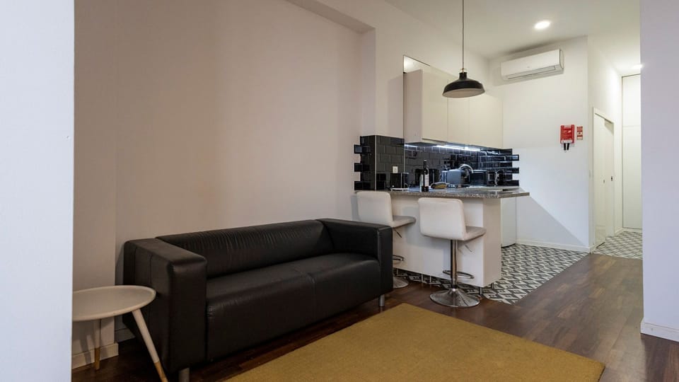 Discover the charm of our living area, adorned with unique accents and comfortable seating #contemporary #practical