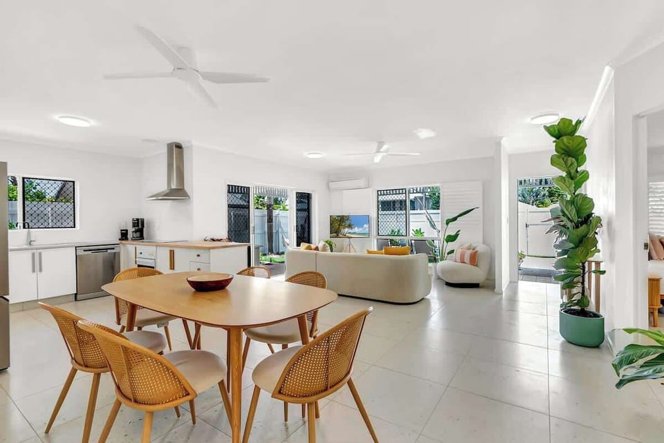 Share meals around the six-seater dining table in the open-plan dining area.
