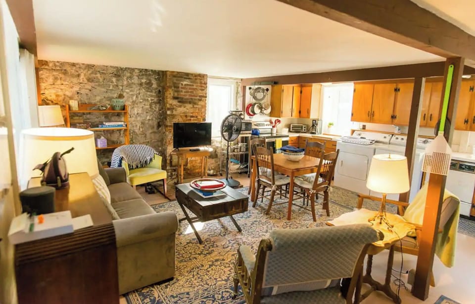 Charming living room with an open concept to the dining table and kitchen.