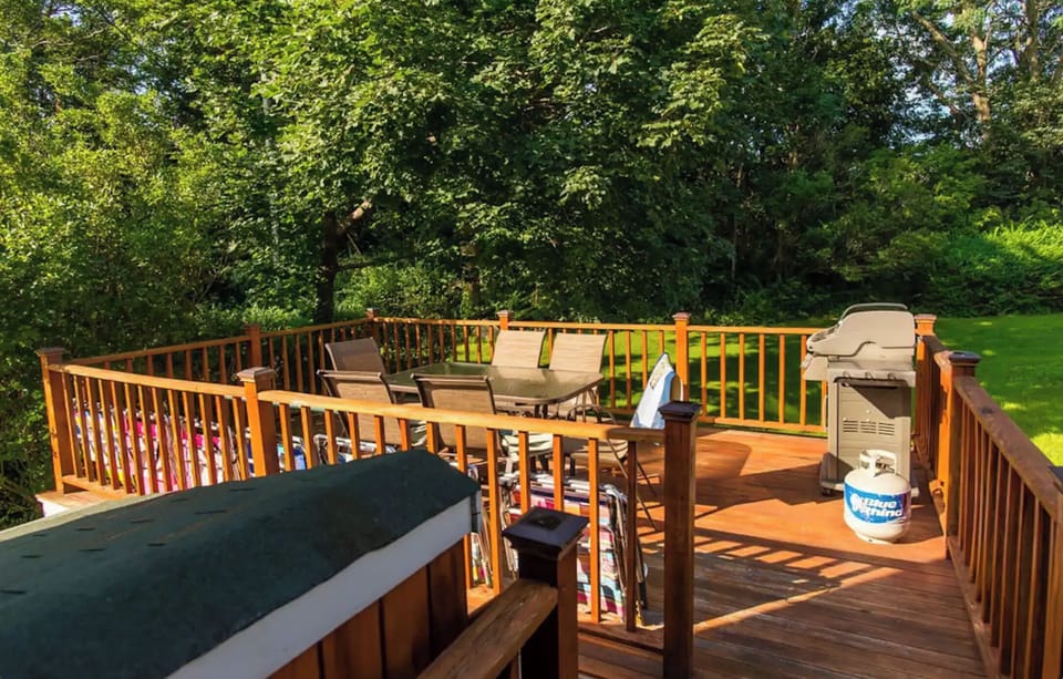 Private balcony complete with cozy seating and a grill. Nice view of the ocean. 