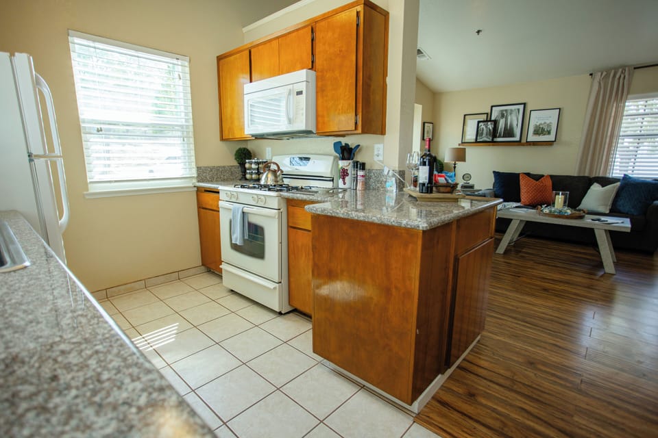 Fully stocked kitchen with oven and microwave