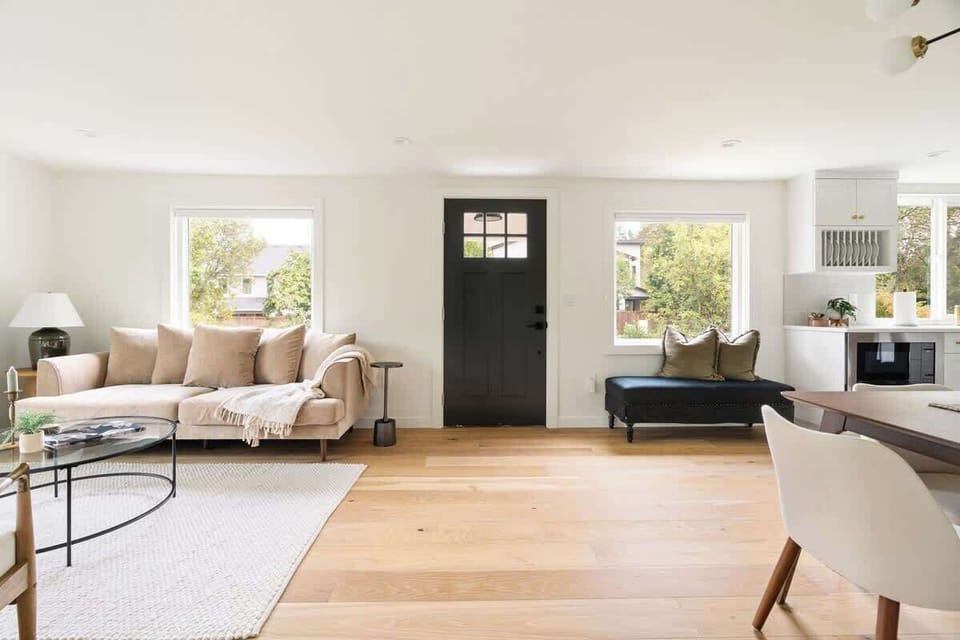 Step into a welcoming entryway with a chic seating area and modern design elements that immediately set the tone for a luxurious stay.