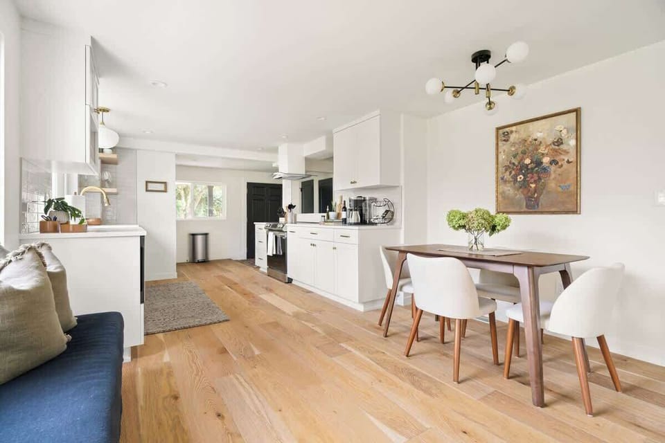 The dining area provides a perfect setting for enjoying meals together, framed by tasteful decor and comfortable seating.