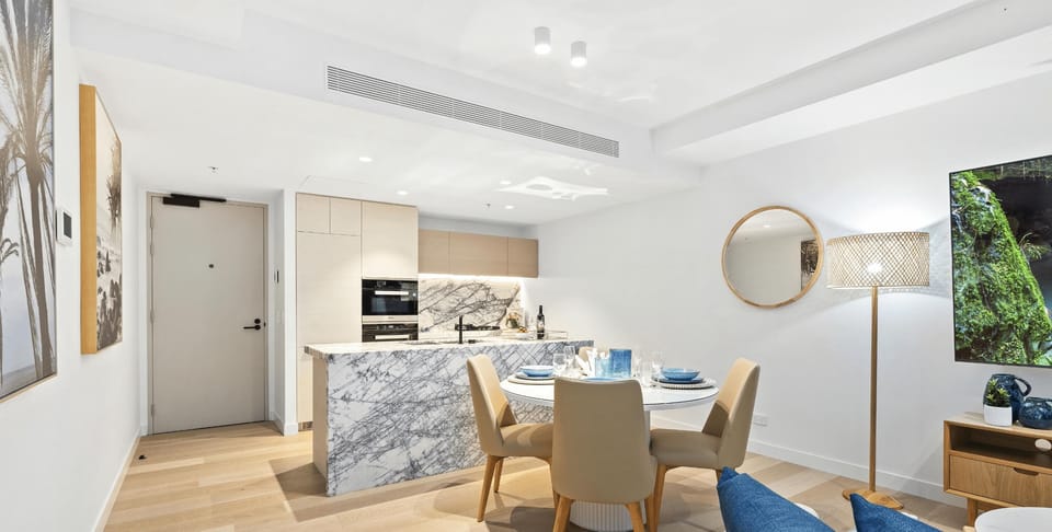 Fully equipped modern kitchen is right next to the dining area