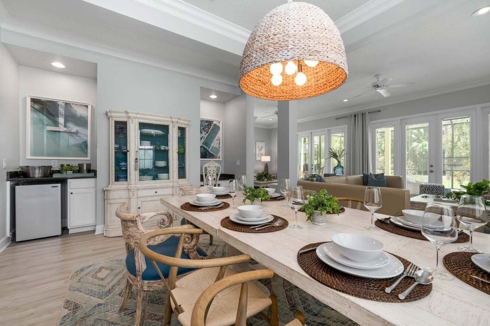 Dining area connected to the fully-equipped kitchen and a mini bar fridge.