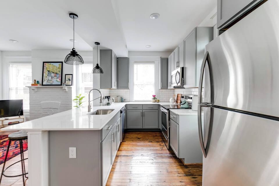 Gourmet Kitchen: Cook and mingle in style with sleek finishes and natural light.