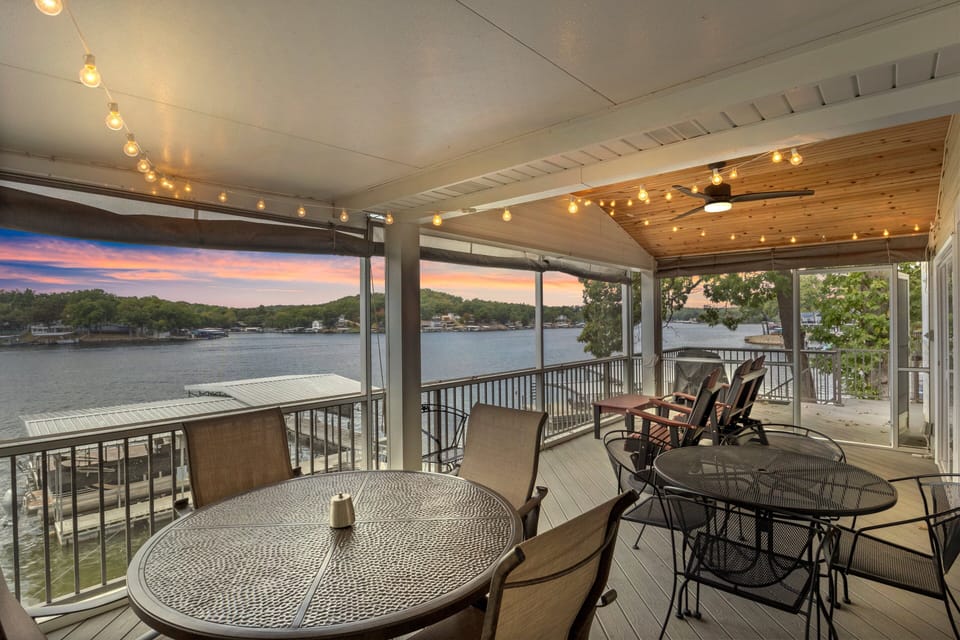 Relax on the screened-in deck with stunning lake views and cozy string lights, perfect for sunset dinners or morning coffee!