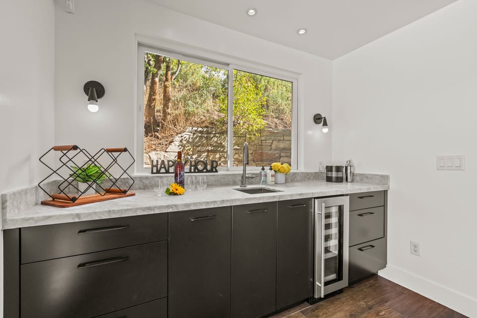 Dining area wet bar with a wine fridge