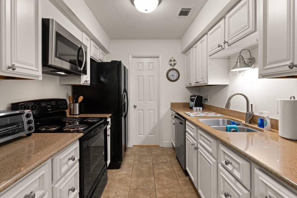 The full-size kitchen is fully stocked with tools you need to cook dinner when you don't feel like going out.