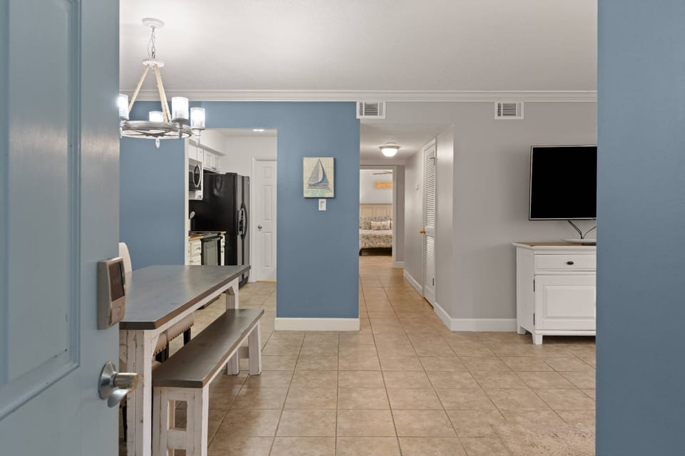 Entering through the front door, you will find yourself walking into main living area of a comfortable beach getaway.
