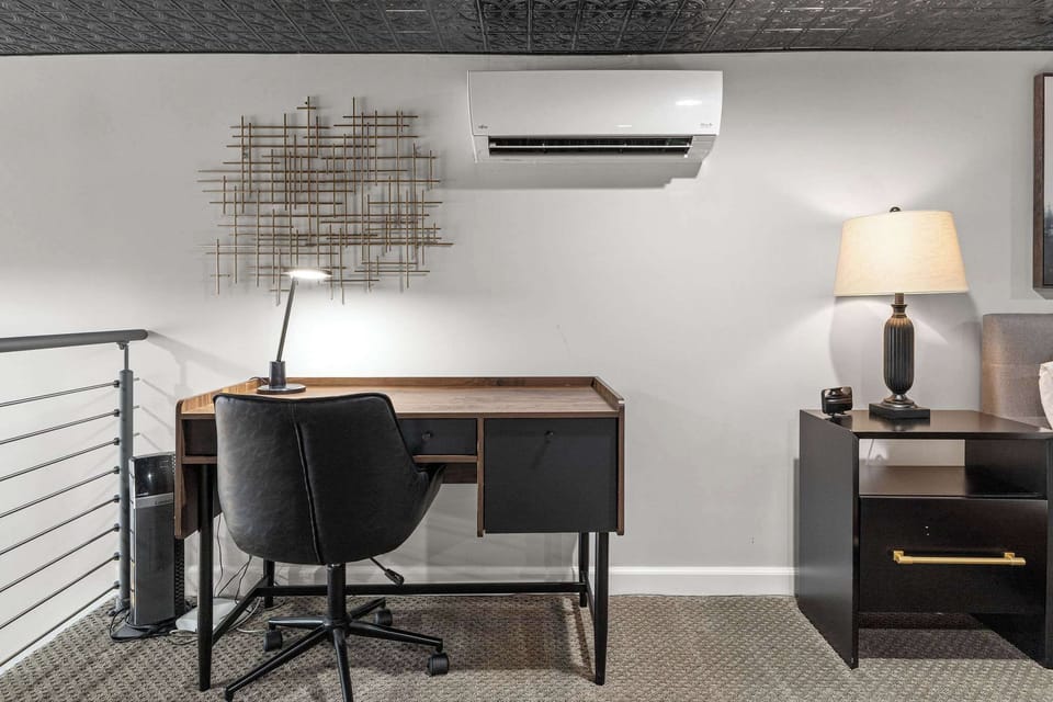 There is a desk in the bedroom so you can get some work done. There is also a partition for privacy and to block light.
