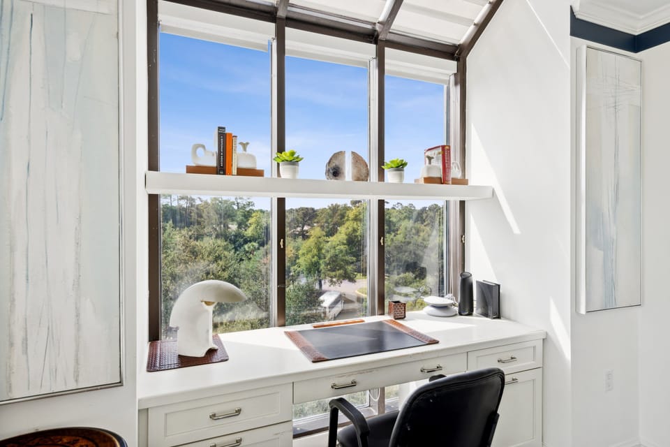 Elevate your journaling or occasional online meeting from the perfect workstation, offering panoramic views of the marina.