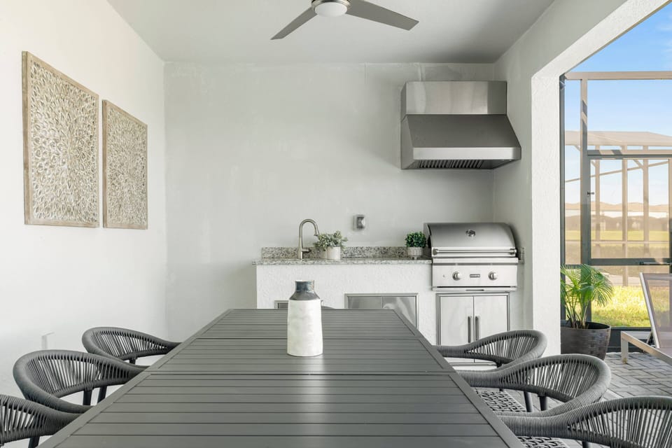 Enjoy a delightful dining experience in our bright space with sleek tables and stylish chairs. Our modern kitchen, featuring a grill and ample counter space, inspires culinary creativity while offering refreshing views from large.