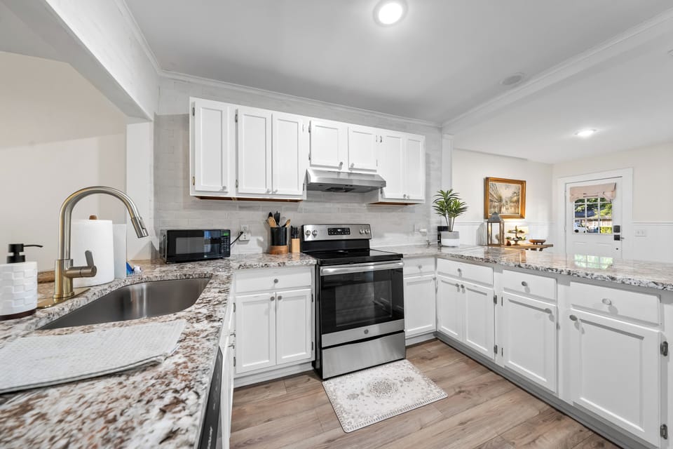 Kitchen is fully stocked with anything that would be needed for cooking. 