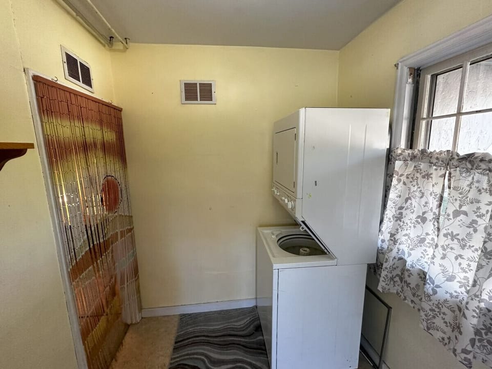 stacker washer and dryer in laundry room