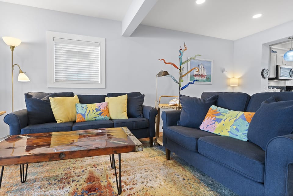 Comfortable upstairs seating area perfect for relaxing after a day by the ocean.
