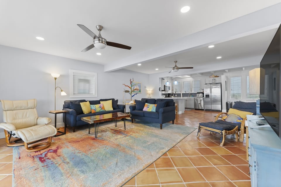 Bright upstairs living room with plenty of seating for everyone