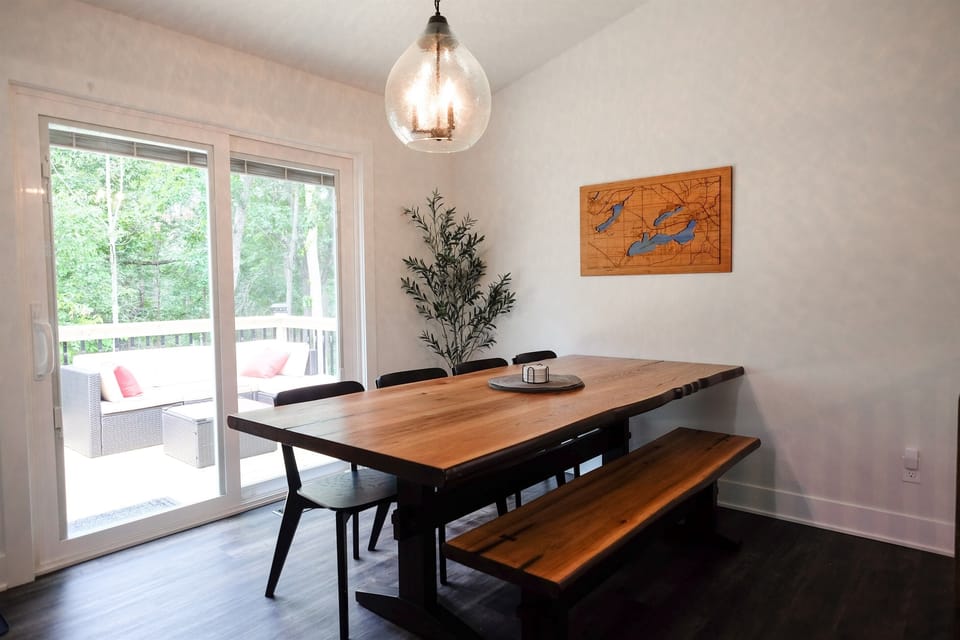 Dining room table with access to the deck and backyard. Additional chair and/or high chair available.