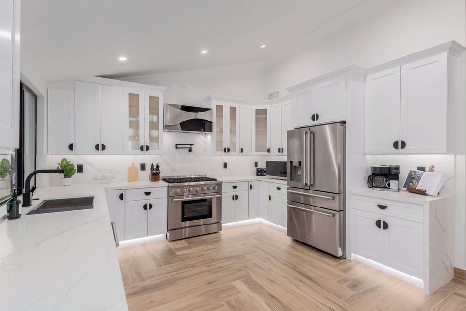 Updated Kitchen with Crisp White Custom Cabinets and Thor Stainless Steel Appliances