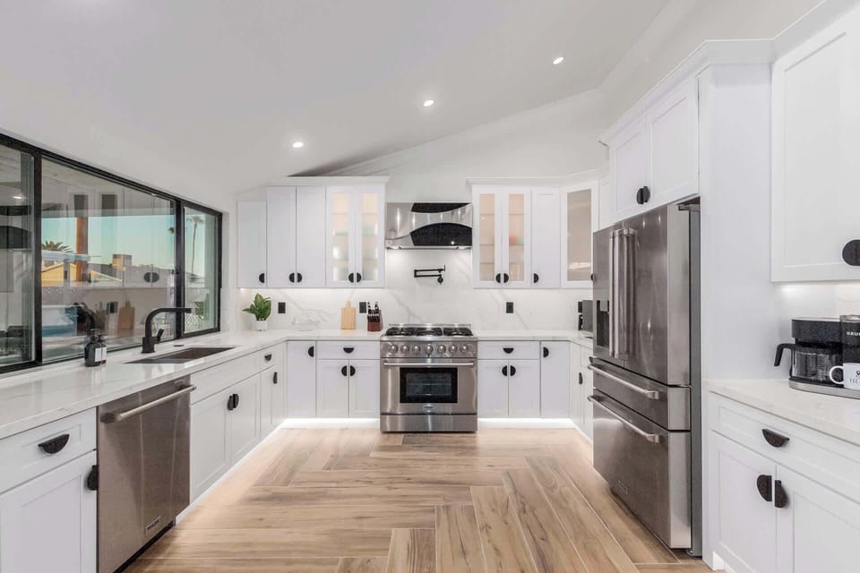Stainless Steel Thor High-End Appliances, Custom Cabinets and Accent Lighting