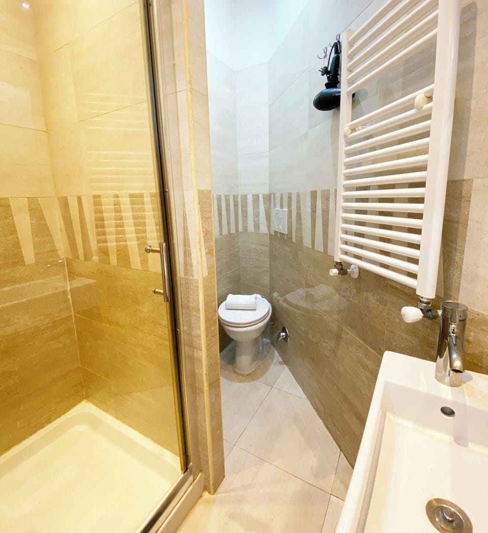 Economy Double Room, Balcony | Bathroom | Shower, hair dryer, towels