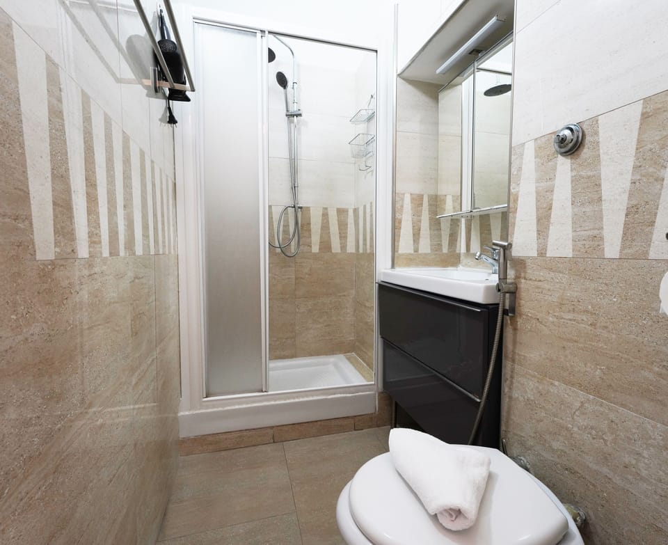 Triple Room, Balcony | Bathroom | Shower, hair dryer, towels