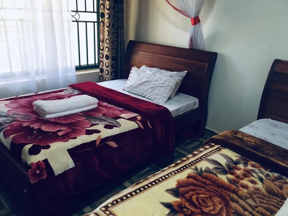 Economy Room, Balcony, Lake View | Desk, laptop workspace, bed sheets