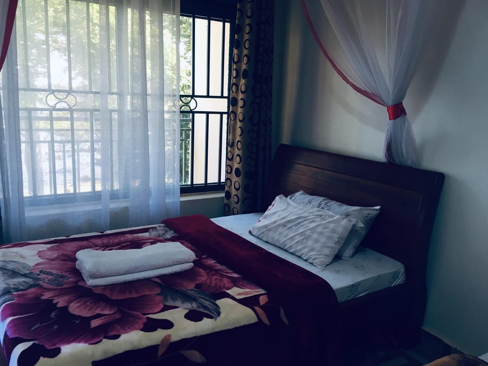 Economy Room, Balcony, Lake View | Desk, laptop workspace, bed sheets