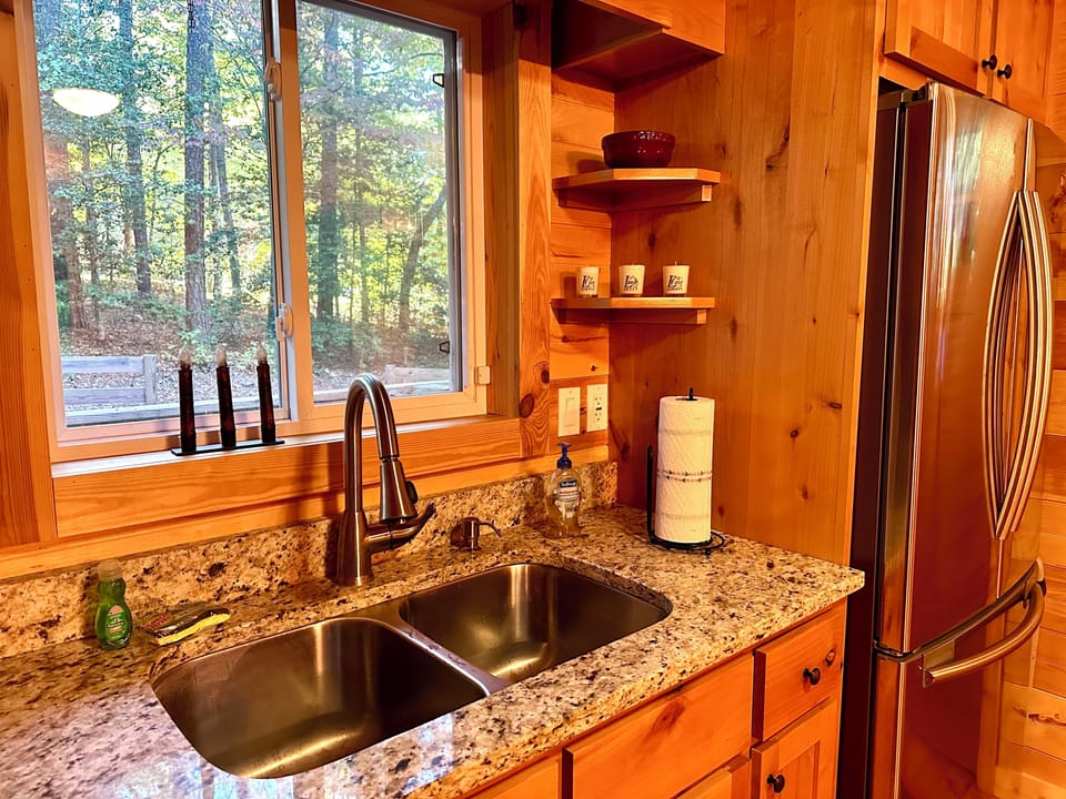 Stainless double sink, stainless appliances, and granite countertops