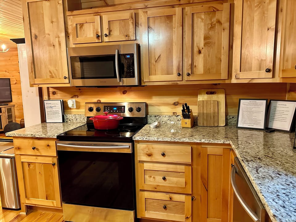 Full sized stove and built in microwave.