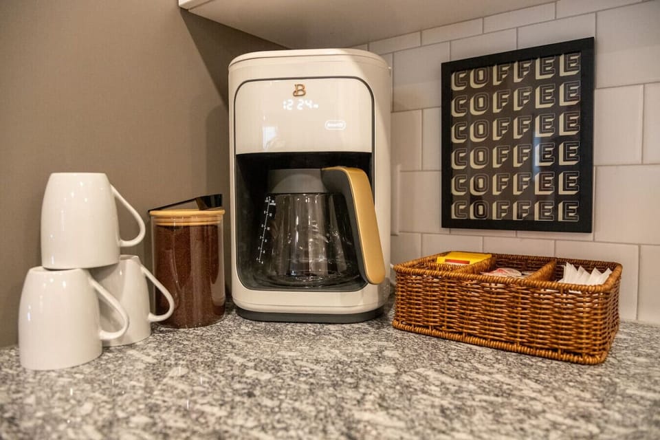 Enjoy the fully stocked coffee station with ground coffee, tea, sugar and creamer!