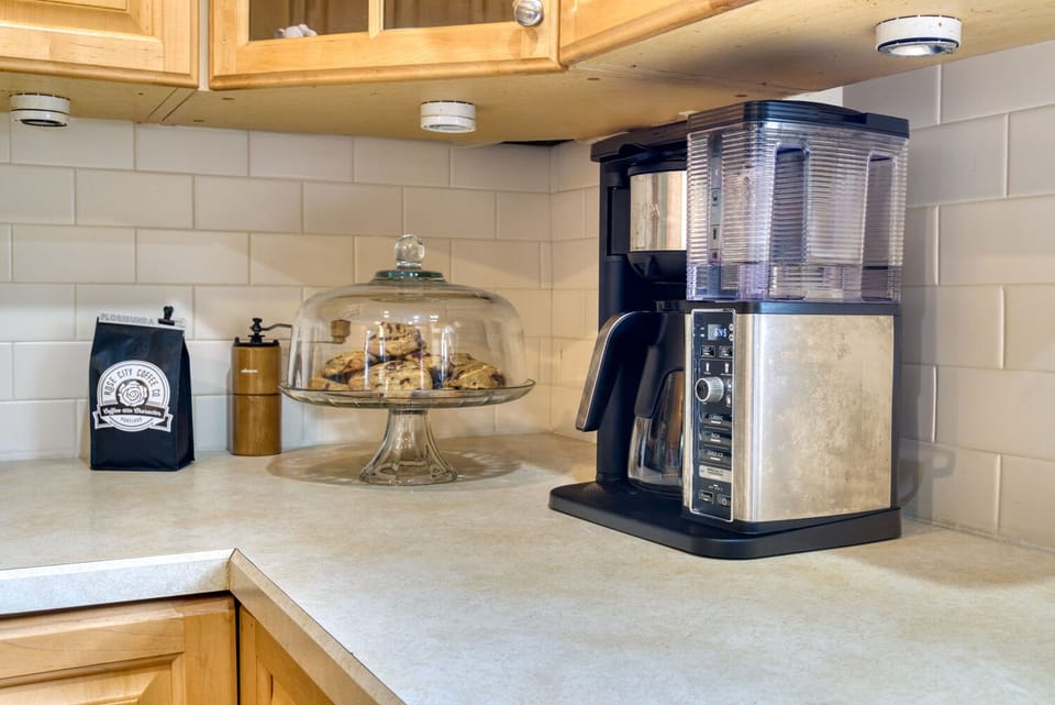 Rose City Coffee, grinder, & maker. Set the timer so it's brewing when u awake.