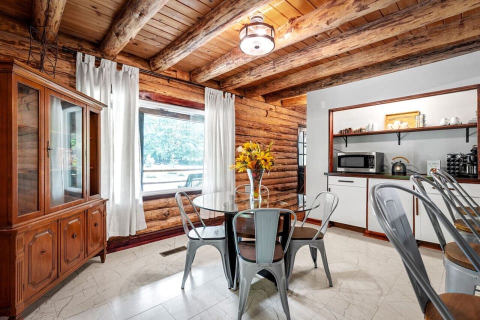 Enjoy casual meals or breakfast at this inviting dining area, seating four, with additional barstool seating at the kitchen island for four more.