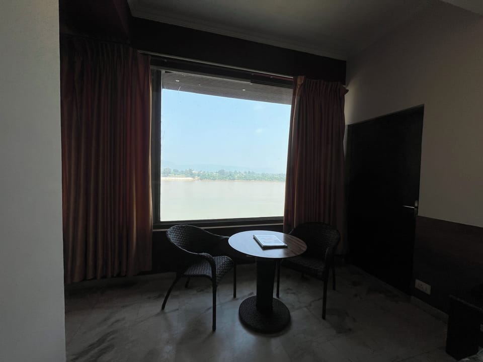 Deluxe Room, River View | Desk, laptop workspace, blackout drapes, soundproofing