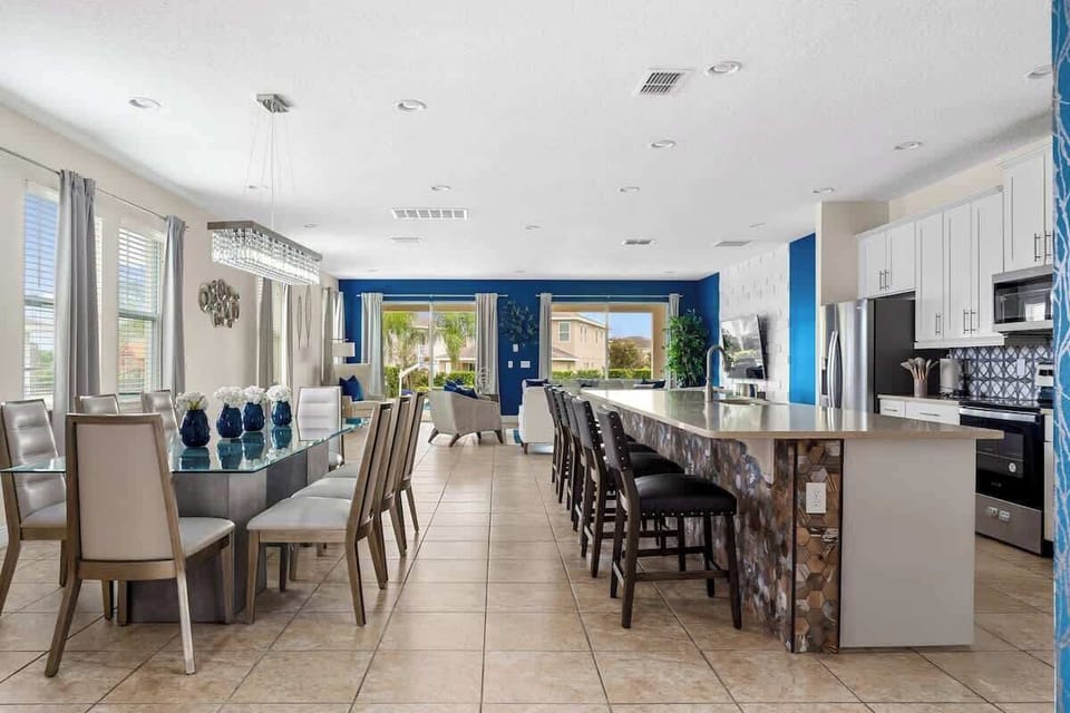 Embrace the seamless flow of our open-concept space featuring a sleek kitchen island, stylish dining area, and cozy living room. Perfect for cooking, dining, and relaxing all in one beautiful setting! ️️✨