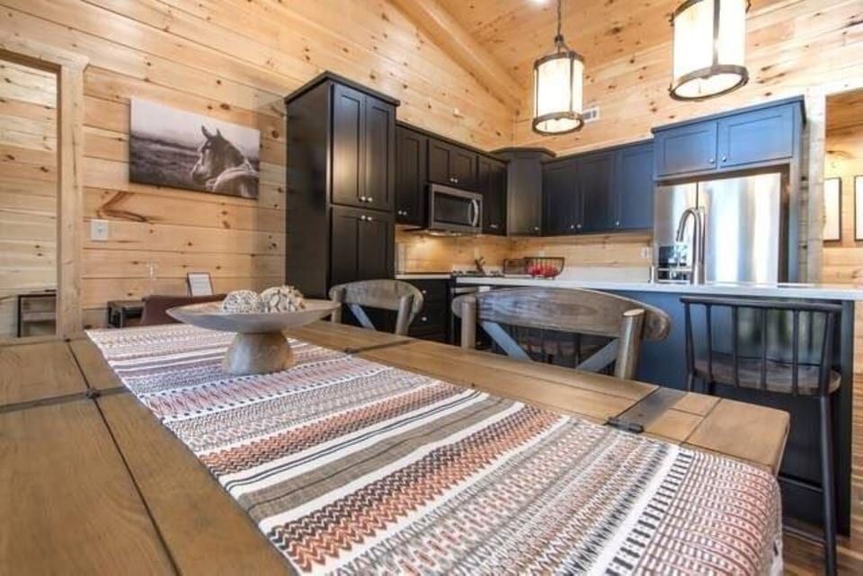 There's plenty of room! Dining table seats 4 and the kitchen island seats 2. 