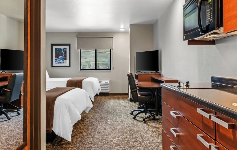 Premium bedding, pillowtop beds, desk, laptop workspace